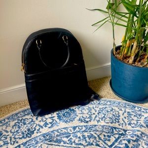 Black backpack with gold accents